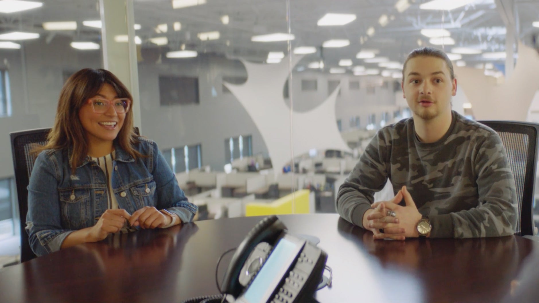 Man and woman sitting at conference table