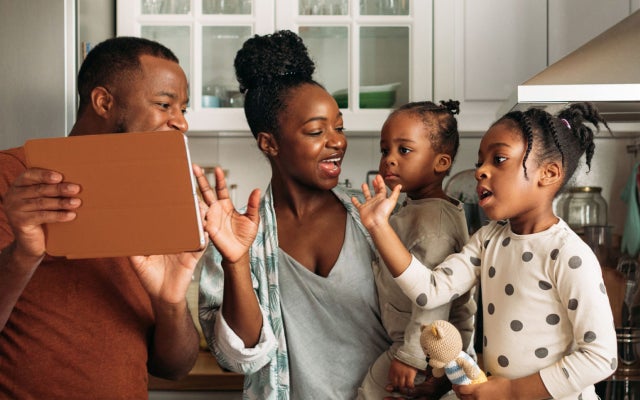 Image depicting happy family of african-american ethnicity in kitchen