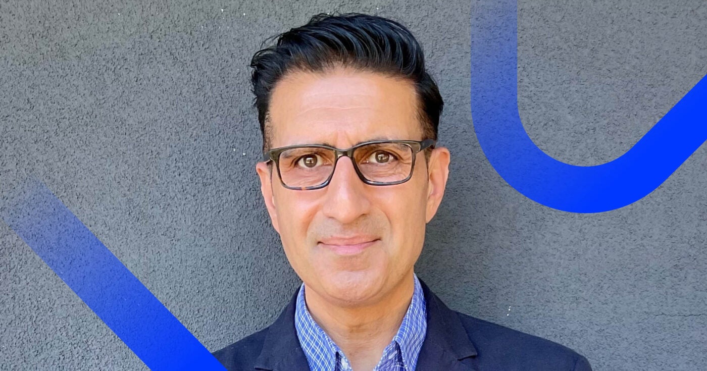 Naman Khan Blend's Head of Marketing Headshot with blue swirls