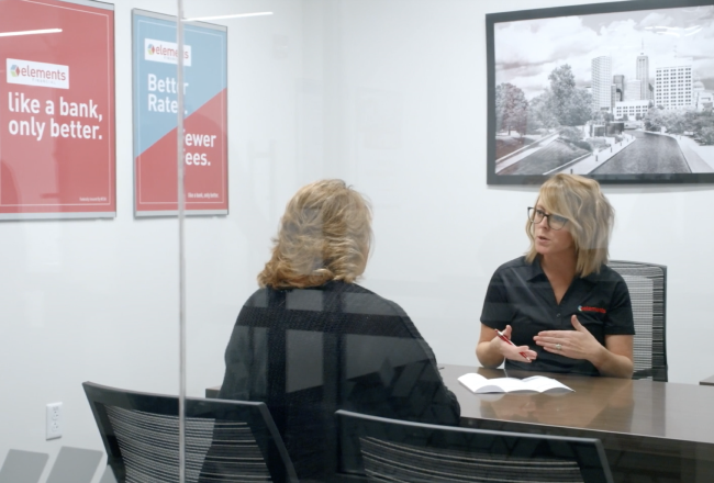 Image of two blonde women in glass office at Elements Financial