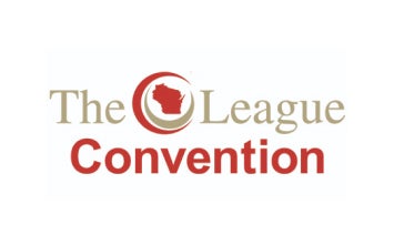 White rectangular card with gold text that reads The League and red text that reads Convention