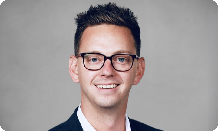 Grey rectangular card with Justin Venhousen headshot
