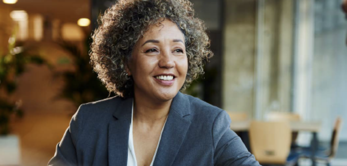 Professional woman sitting at a office environment