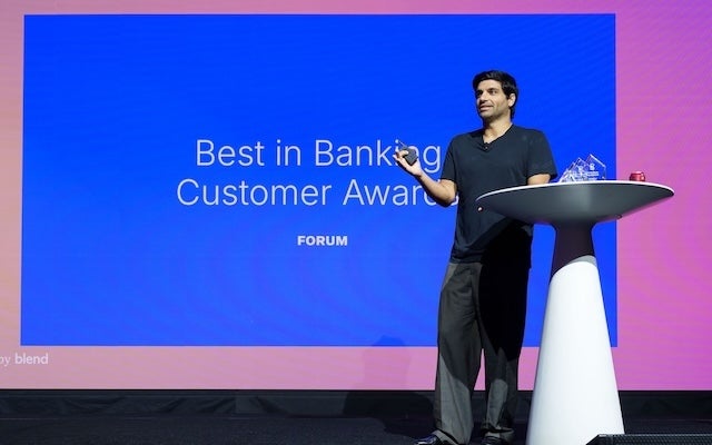 Photo of Nima Ghamsari, Head of Blend, on stage at Forum 2025 for the Best in Banking Customer Awards presentation.
