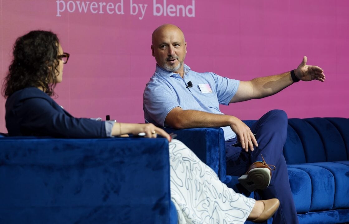 Two people discussing digital home equity origination on stage at Blend Forum 2025.